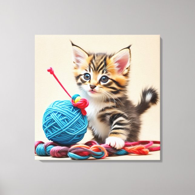 Kitten playing with a ball of thread canvas print (Front)