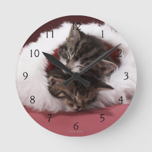 Kittens asleep together in Christmas hat Round Clock