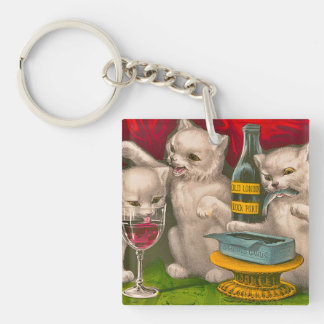 Kittens drinking and eating sardine fish key ring