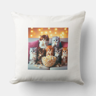 Kittens enjoy eating popcorn cushion