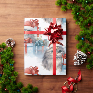 Kittens peeking from gift wrap