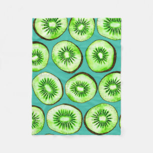 Kiwi slices on turquoise fleece blanket