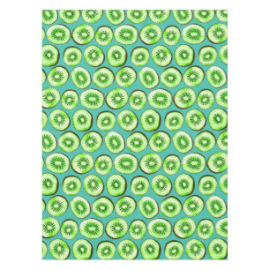 Kiwi slices on turquoise tablecloth
