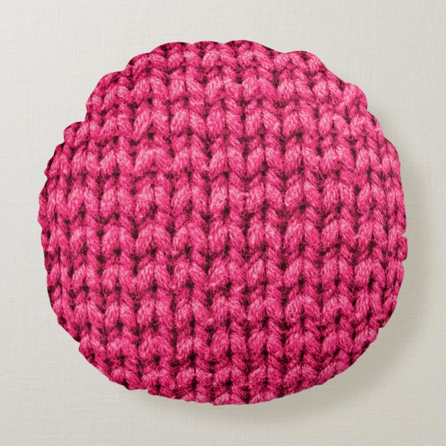 Knitted pink background. Yarn texture. Vertical kn Round Cushion (Front)