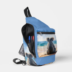 Koala looking at the ocean sling bag