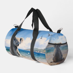 Koala on a sandy beach duffle bag