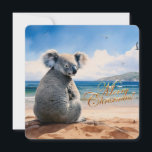 Koala on a sandy beach Merry Christmas Holiday Card<br><div class="desc">Iconic Australian Koala soaking up the sun and sea on a sandy beach with a clear blue sky Merry Christmas greeting on front Merry Christmas and Happy New Year on back This furry koala is a native of Australia they are easily recognizable by their stout, tailless body and large head...</div>