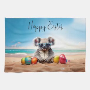 Koala on beach with Easter eggs Happy Easter Tea Towel