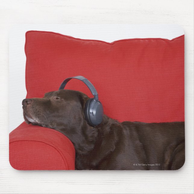 Labrador wearing headphones lying on sofa mouse mat (Front)