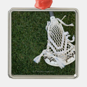 Lacrosse stick on grass metal tree decoration