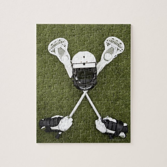 Lacrosse sticks, gloves, balls and sports helmet jigsaw puzzle (Vertical)