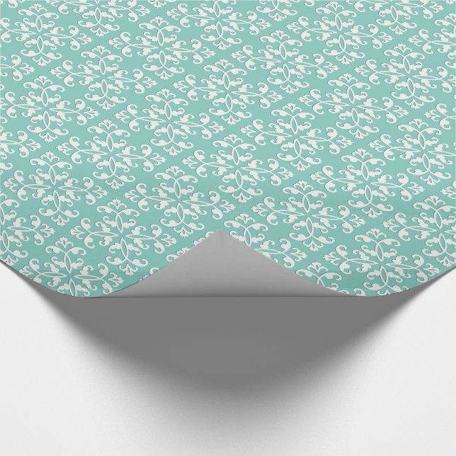 Lacy cutwork - white over seafoam green wrapping paper (Corner)
