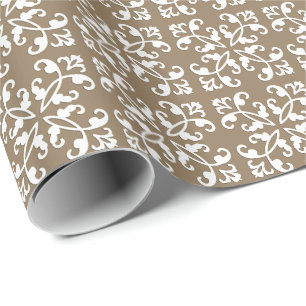 Lacy cutwork - white over taupe tan wrapping paper