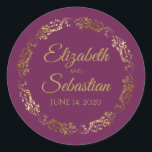 Lacy Gold Filigree Elegant Cassis Purple Wedding Classic Round Sticker<br><div class="desc">These elegant wedding stickers feature fancy gold script text on a cassis purple,  magenta,  or berry coloured background with a lacy gold faux foil floral border. The text is fully customisable and contains the wedding couple's names and wedding date. Great as favour tags or envelope seals!</div>