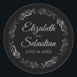 Lacy Silver Filigree Elegant Black Wedding Classic Round Sticker<br><div class="desc">These elegant wedding stickers feature fancy pale grey script text on a black background with a lacy silver faux foil floral border. The text is fully customisable and contains the wedding couple's names and wedding date. Great as favour tags or envelope seals!</div>