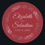 Lacy Silver Filigree Elegant Red Wedding Classic Round Sticker<br><div class="desc">These elegant wedding stickers feature fancy pale gray script text on a red background with a lacy silver faux foil floral border. The text is fully customizable and contains the wedding couple's names and wedding date. Great as favor tags or envelope seals!</div>