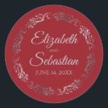 Lacy Silver Filigree Elegant Red Wedding Classic Round Sticker<br><div class="desc">These elegant wedding stickers feature fancy pale gray script text on a red background with a lacy silver faux foil floral border. The text is fully customizable and contains the wedding couple's names and wedding date. Great as favor tags or envelope seals!</div>