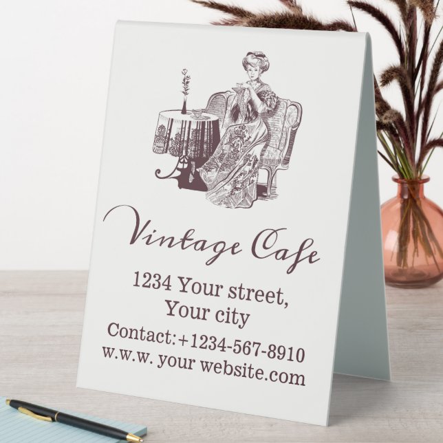 Lady drinks tea table tent sign (In SItu (Table))