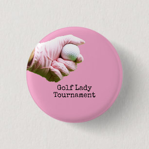 Lady golfer is holding golf ball on pinkbackground 3 cm round badge