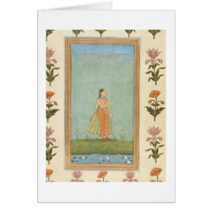 Lady holding a flower, standing by a lily pond, fr
