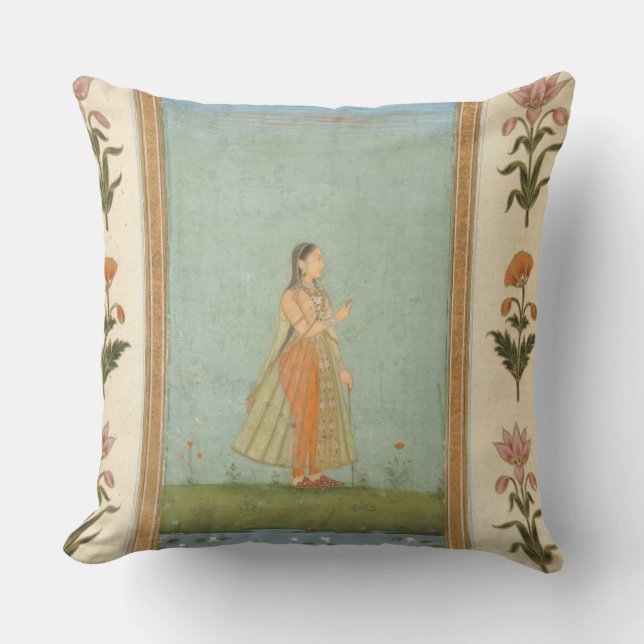 Lady holding a flower, standing by a lily pond, fr cushion (Front)