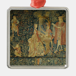 Lady playing the portative organ from metal tree decoration