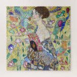 Lady with A Fan, Gustav Klimt Jigsaw Puzzle<br><div class="desc">Gustav Klimt (July 14, 1862 – February 6, 1918) was an Austrian symbolist painter and one of the most prominent members of the Vienna Secession movement. Klimt is noted for his paintings, murals, sketches, and other objets d'art. In addition to his figurative works, which include allegories and portraits, he painted...</div>