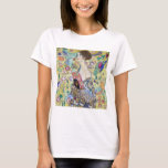 Lady with A Fan, Gustav Klimt T-Shirt<br><div class="desc">Gustav Klimt (July 14, 1862 – February 6, 1918) was an Austrian symbolist painter and one of the most prominent members of the Vienna Secession movement. Klimt is noted for his paintings, murals, sketches, and other objets d'art. In addition to his figurative works, which include allegories and portraits, he painted...</div>