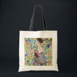 Lady with A Fan, Gustav Klimt Tote Bag<br><div class="desc">Gustav Klimt (July 14, 1862 – February 6, 1918) was an Austrian symbolist painter and one of the most prominent members of the Vienna Secession movement. Klimt is noted for his paintings, murals, sketches, and other objets d'art. In addition to his figurative works, which include allegories and portraits, he painted...</div>