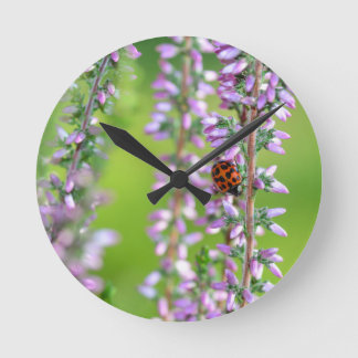 Ladybird on purple flower - round clock
