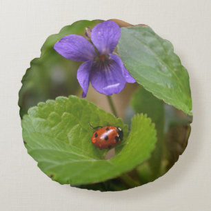 Ladybug on Sweet Violet Flowers Round Cushion