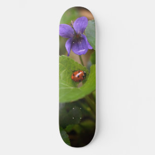 Ladybug on Sweet Violet Flowers Skateboard