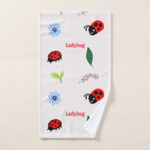 Ladybug pattern on grey hand towel