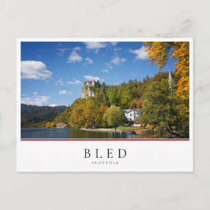 Lake Bled with trees in autumn colours in Slovenia Postcard