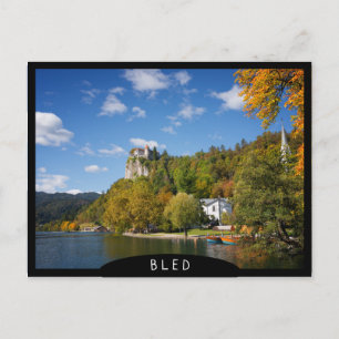 Lake Bled with trees in autumn colours in Slovenia Postcard
