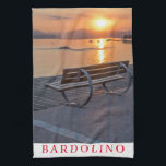 Lake Garda Bardolino sunset tea towel<br><div class="desc">A beautiful photograph of a bench on the promenade in the village of Bardolino on Lake Garda in Italy at sunset printed on a souvenir tea towel.</div>