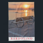 Lake Garda Bardolino sunset tea towel<br><div class="desc">A beautiful photograph of a bench on the promenade in the village of Bardolino on Lake Garda in Italy at sunset printed on a souvenir tea towel.</div>
