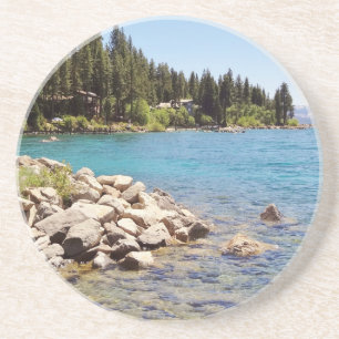 Lake Tahoe's clear waters with snowy mountains Coaster