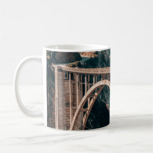 LANDSCAPE PHOTOGRAPHY OF GRAY CONCRETE BRIDGE COFFEE MUG