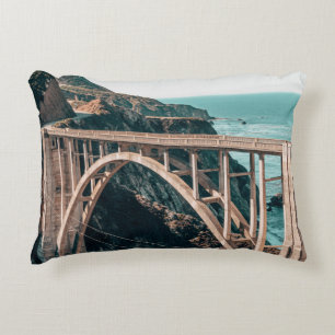LANDSCAPE PHOTOGRAPHY OF GRAY CONCRETE BRIDGE DECORATIVE CUSHION