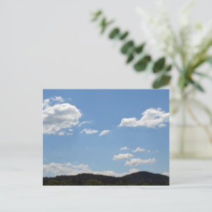 Landscape with green hills, trees & clouds postcard
