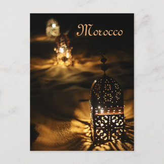 Lanterns glowing in the Moroccan desert night. Postcard