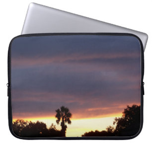 Laptop sleeve with bruise coloured sunset and palm