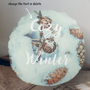 Larch cones on the fresh blue snow round cushion