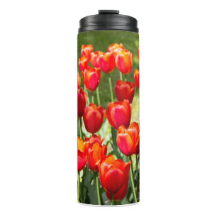 Large field of red tulips thermal tumbler