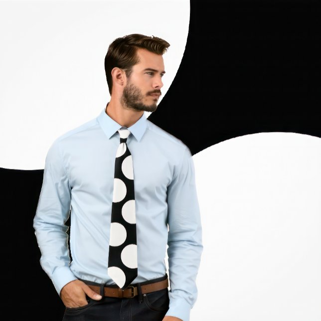 Large White Dots on Black Background Tie (Man wears a necktie with large white polka dots on black.)
