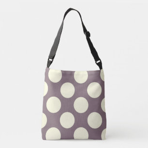 Large white polka dots design on purple crossbody bag