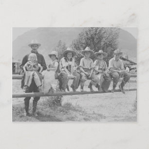 Larry Larom with six children. Postcard