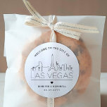 Las Vegas Skyline | Wedding Welcome Message Classic Round Sticker<br><div class="desc">Enhance your wedding welcome packages or event party favours with a custom set of welcome stickers! These elegant yet minimal-style stickers are tailored for a wedding taking place in the beautiful city of Las Vegas. They feature a modern deco skyline with the name of the city integrated underneath. All elements...</div>