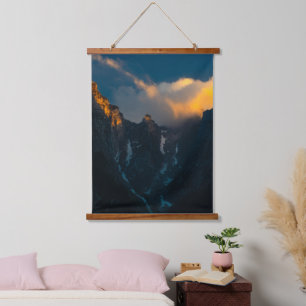 Last breath of sun shining on majestic mountains hanging tapestry